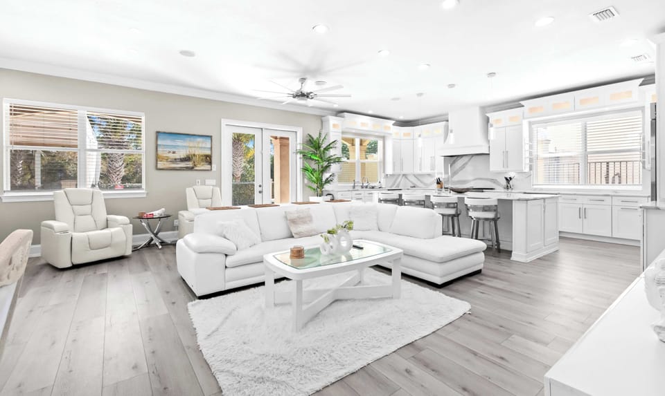 Living room: 85" Smart TV, open-concept lounge, main floor