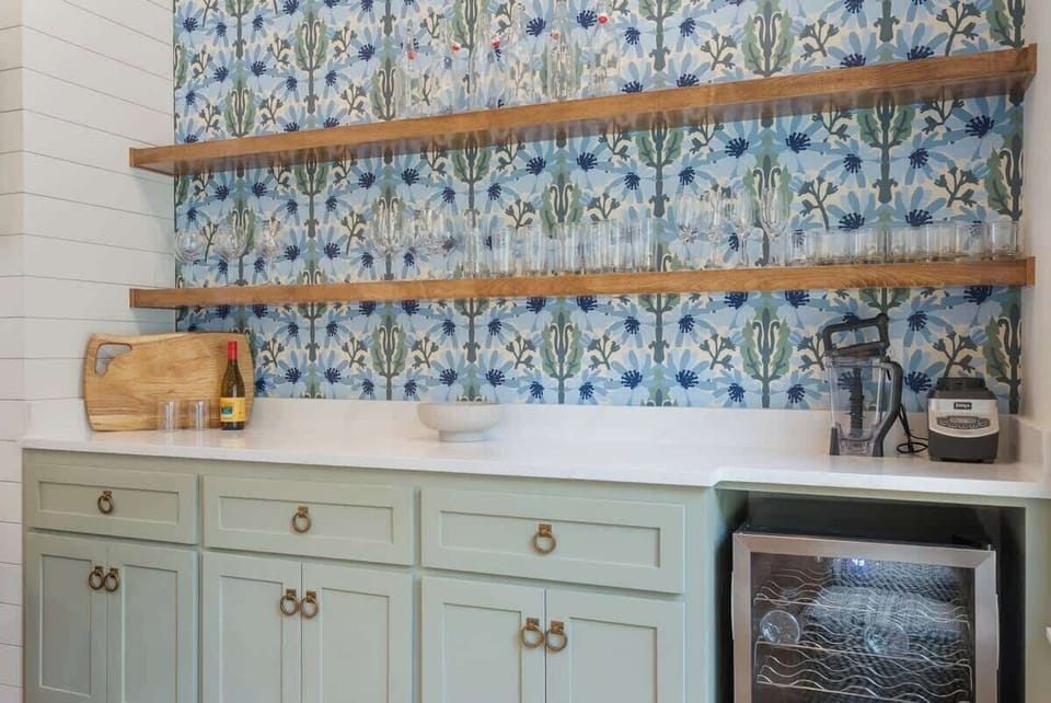 Built-in shelving w/ colorful tile backdrop & ample storage space