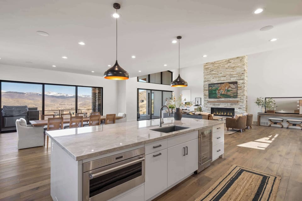 Expansive chef’s kitchen with oversized island and mountain views