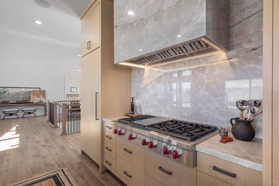 Premium Wolf range with custom hood and designer finishes