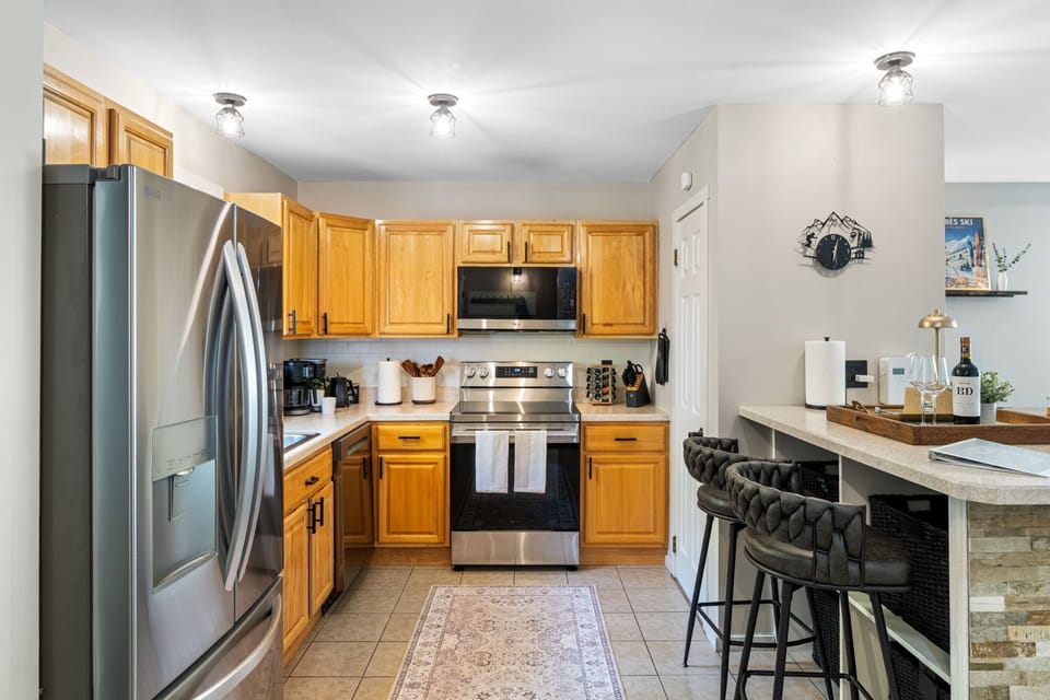 Bright, clean kitchen with plenty of counter space—perfect for prepping meals, morning coffee, and everything in between.