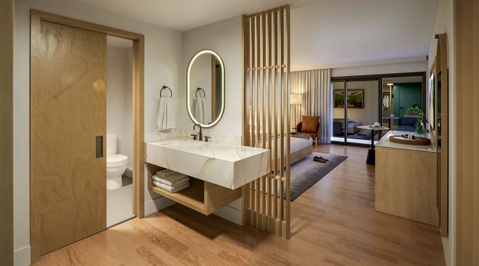 Imagine arriving to a spacious suite with calming, clean lines.