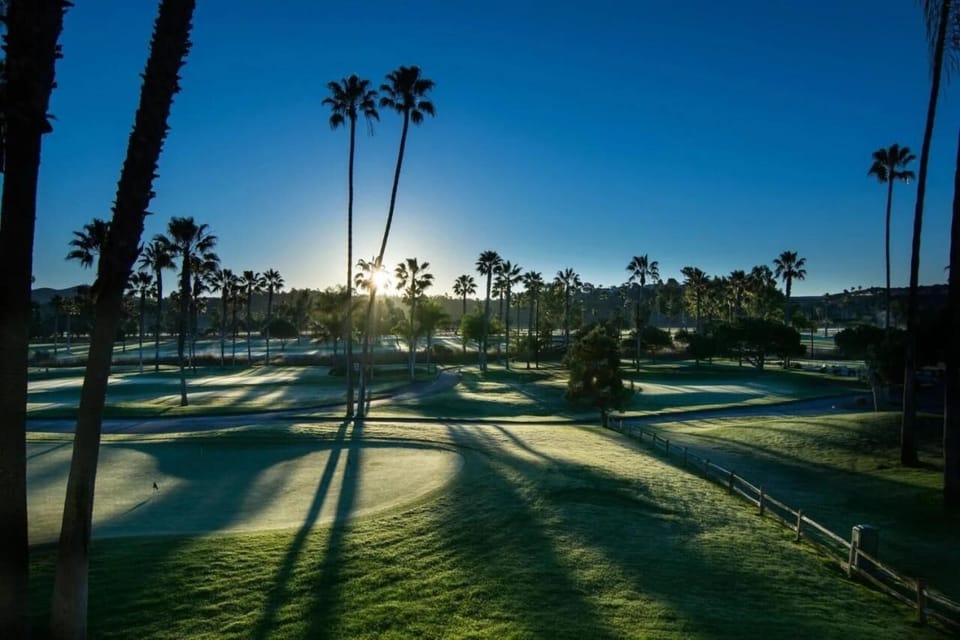 Wake up early and watch sunrise spill across the course.