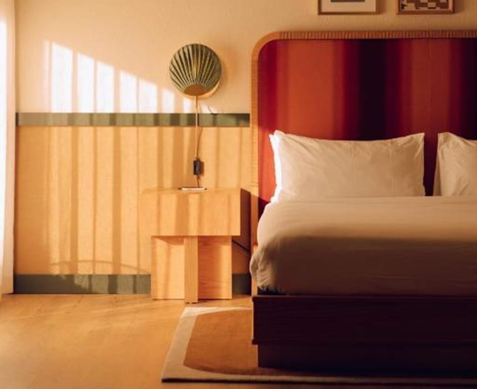 Sink into serene comfort with warm light and quiet ambiance.