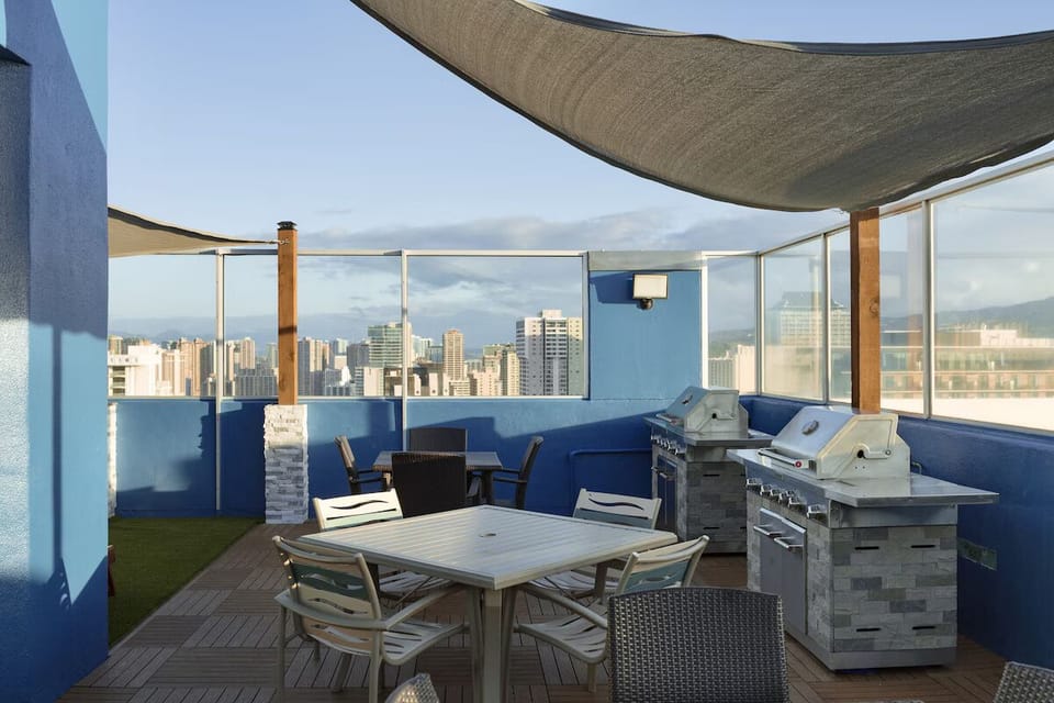 Gather for sunset grilling on the rooftop with skyline views.