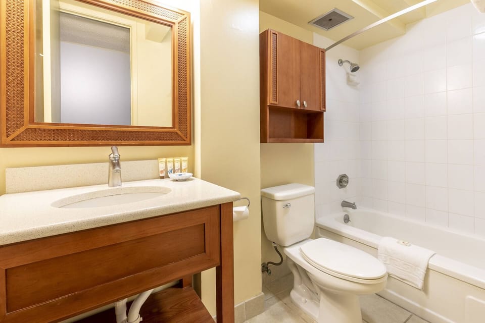 Refresh easily in a spotless bath with bright vanity lighting