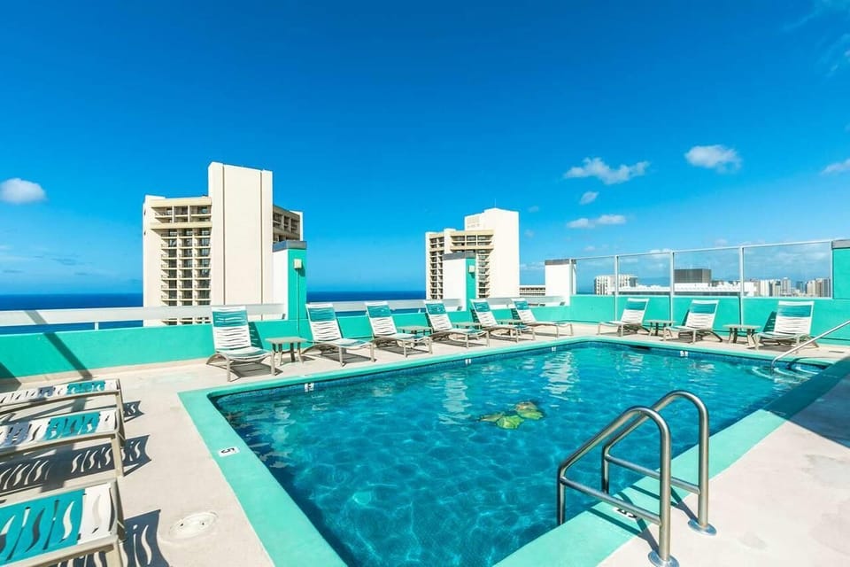 Stretch out on loungers, then cool off in crystal water.