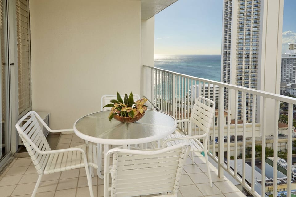 Sip sunset drinks on the breezy balcony with ocean views.