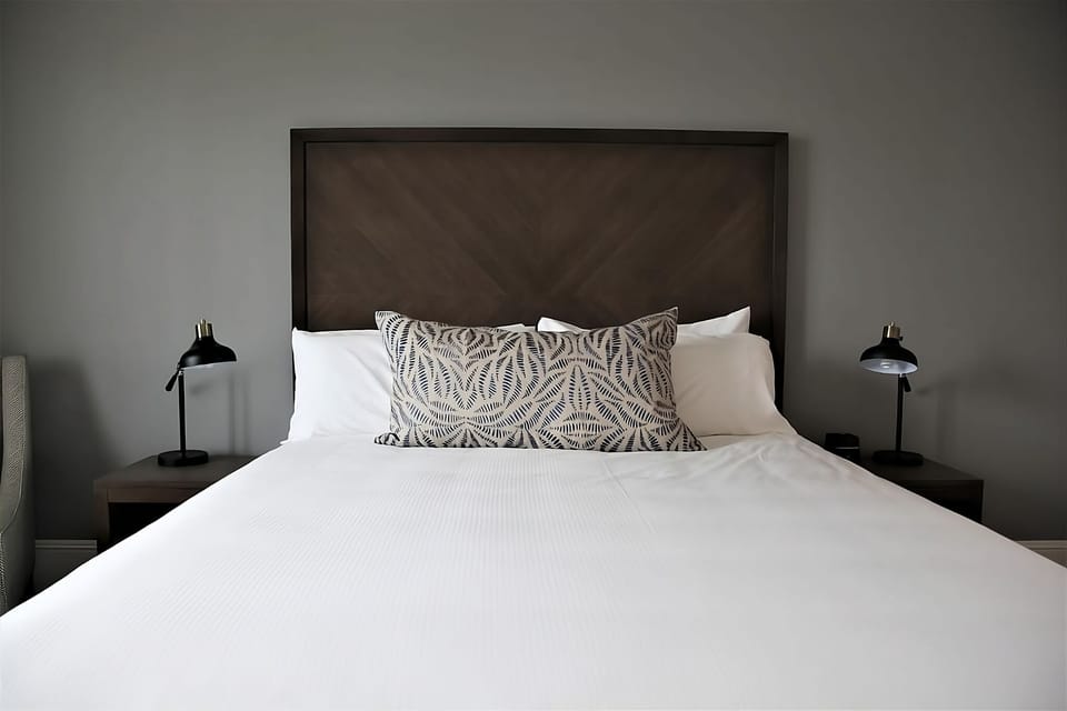 Sink into crisp linens for a calm, restful night.