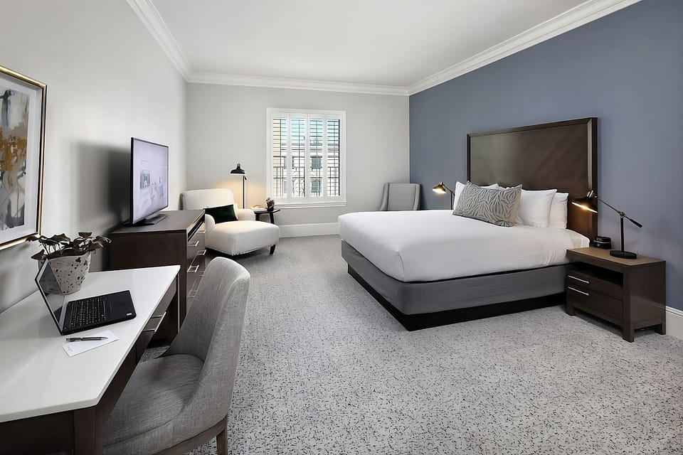 Unwind in a spacious king room with dedicated work desk.