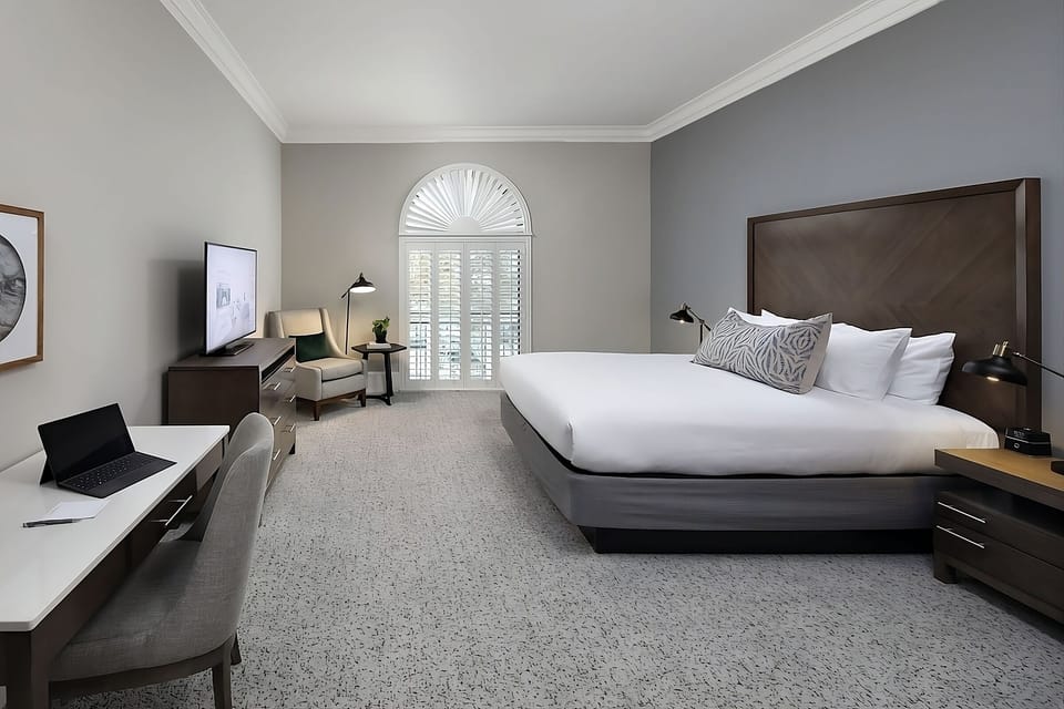 Unwind in a spacious king room with serene natural light.