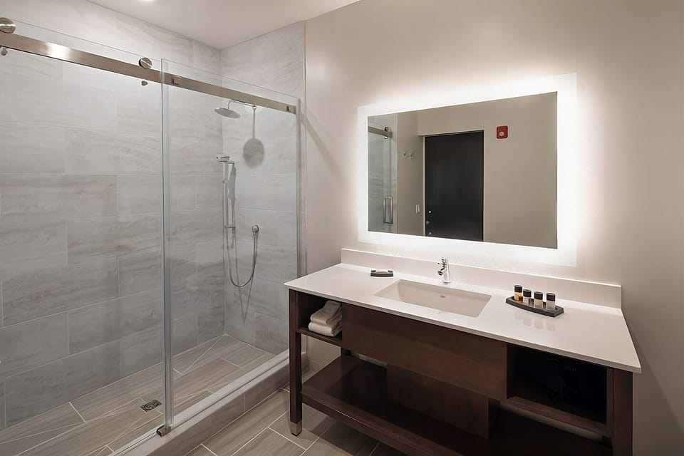 Indulge in a sleek rainfall shower after a long day.