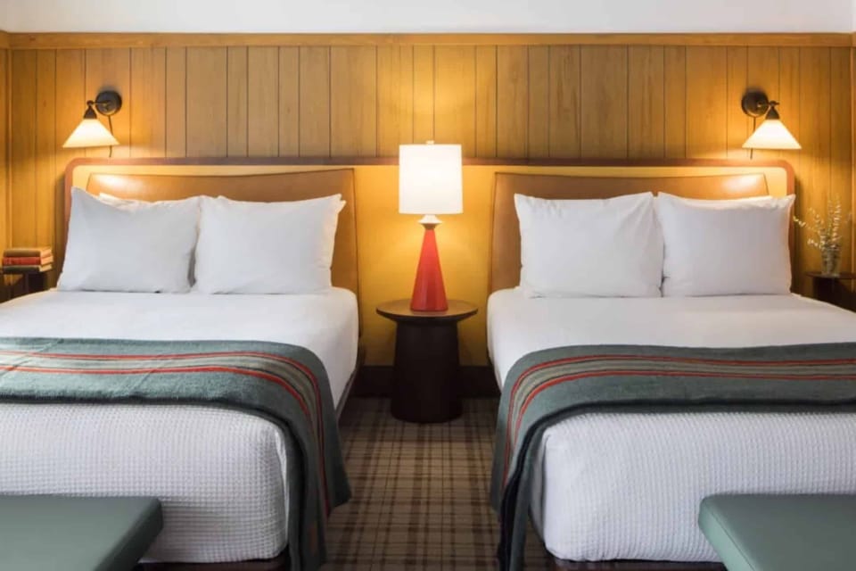 Drift off between crisp linens and soft bedside lighting.