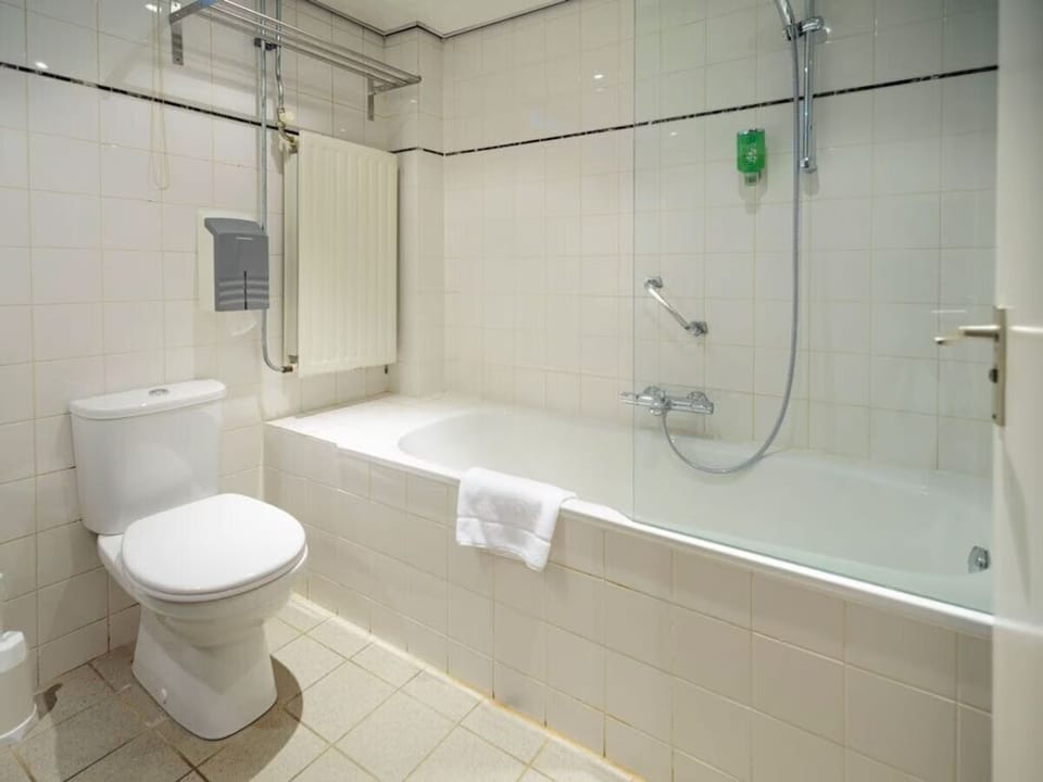 Rejuvenate in the bright, spotless bathroom with tub and shower.