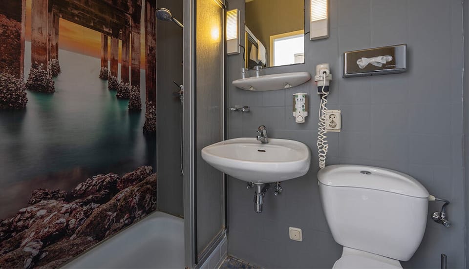 Step into a clean, compact bathroom with walk-in shower