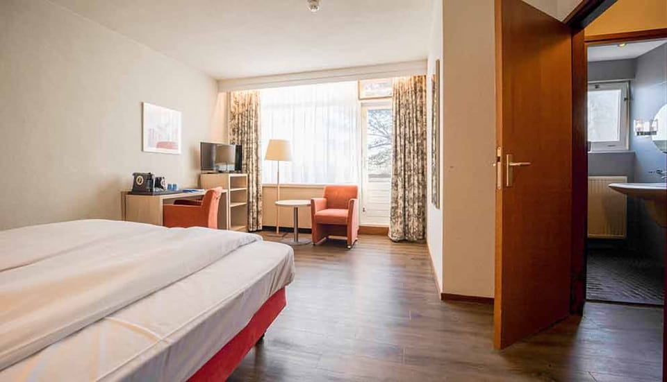 Ease into your stay with seating nook and ensuite access.