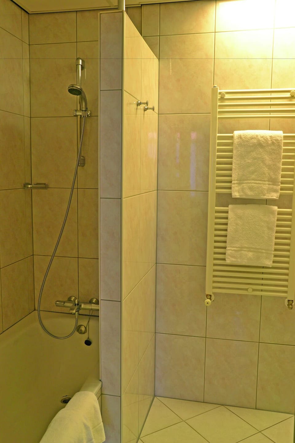 Rinse off comfortably with a spacious shower-tub combination.