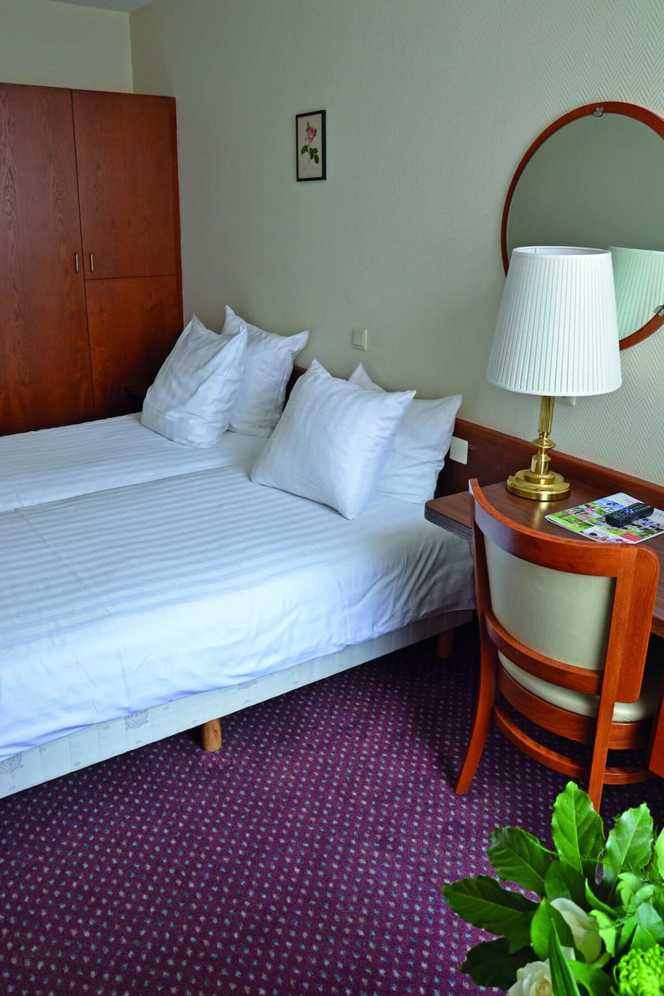 Sleep soundly in twin beds with classic, comfortable furnishings.
