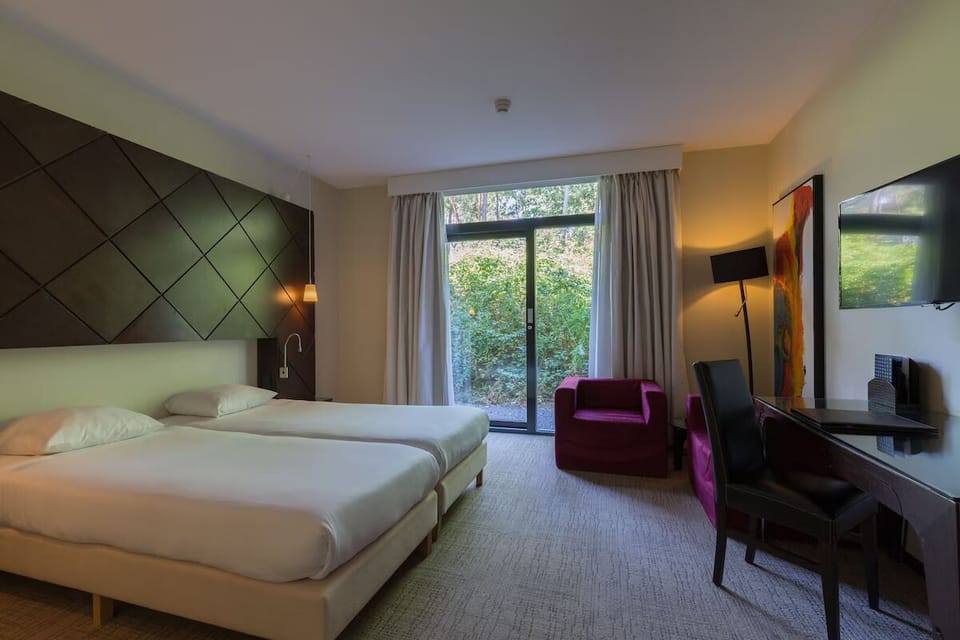 Wake refreshed to leafy views through floor-to-ceiling doors.