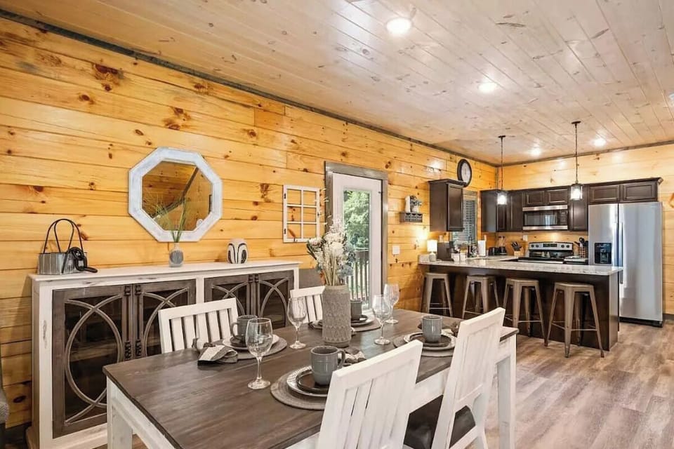 You'll love preparing meals in this spacious open kitchen with modern appliances, then gathering around the rustic dining table for memorable dinners together.