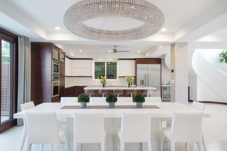 Elegant dining area with statement chandelier—great for intimate meals or group gatherings.