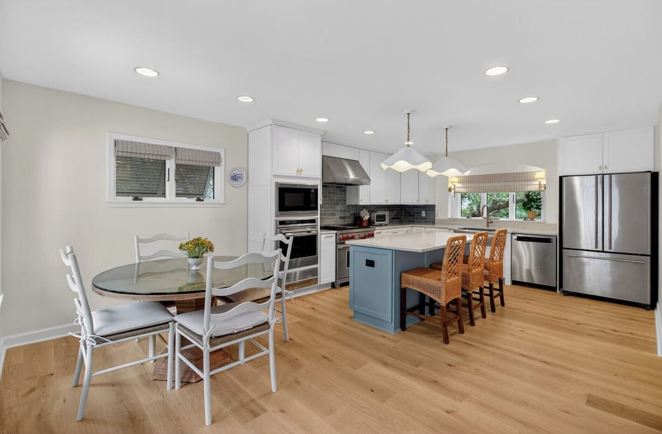 Step into your bright, modern kitchen where coastal charm meets functionality. Prepare meals on spacious counters while guests gather around the island.