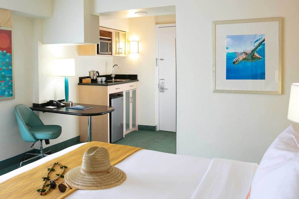 Enjoy suite-style comfort with kitchenette convenience steps from bed.