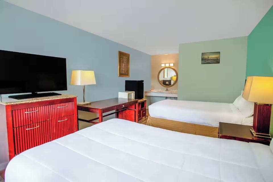Settle in with big-screen TV and convenient in-room vanity.