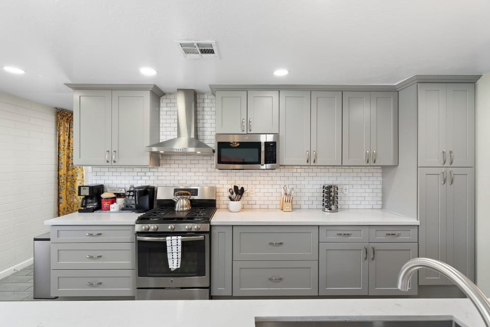Bright open kitchen featuring stylish cabinetry