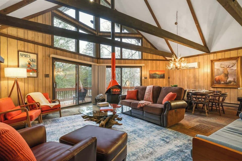 Enjoy stunning views and a charming fireplace in a spacious gathering space!