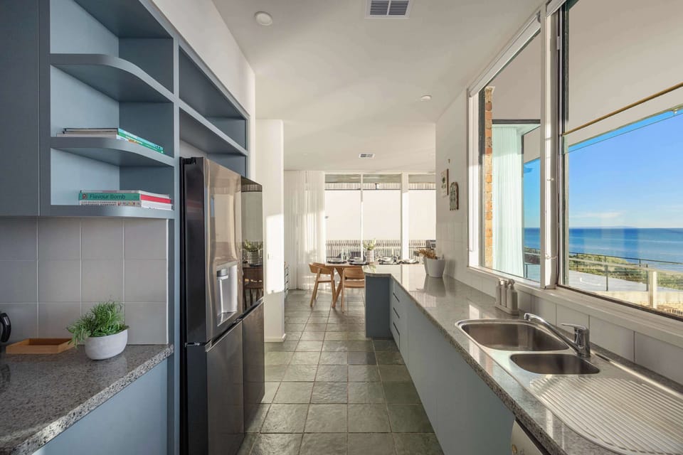 The galley, open kitchen - leading into the breakfast dining area. New appliances throughout