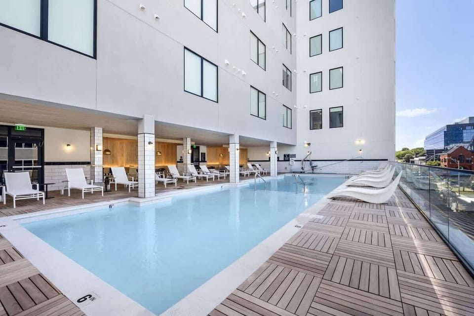 Communal Area: The Sparkling blue pool on the 3rd floor has city views and sun loungers.