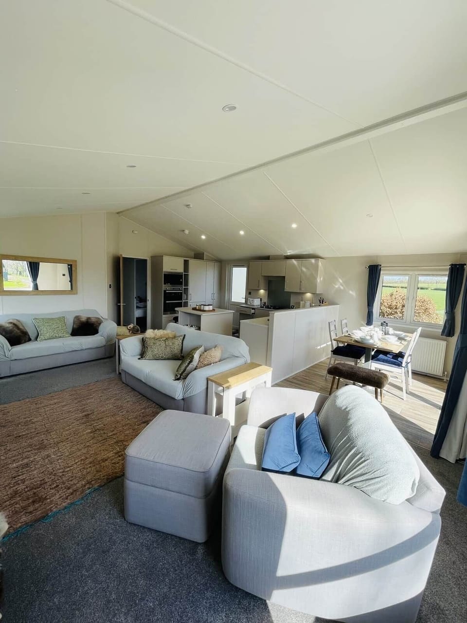 Modern self-catering kitchen and bright lounge in the Cotswolds.