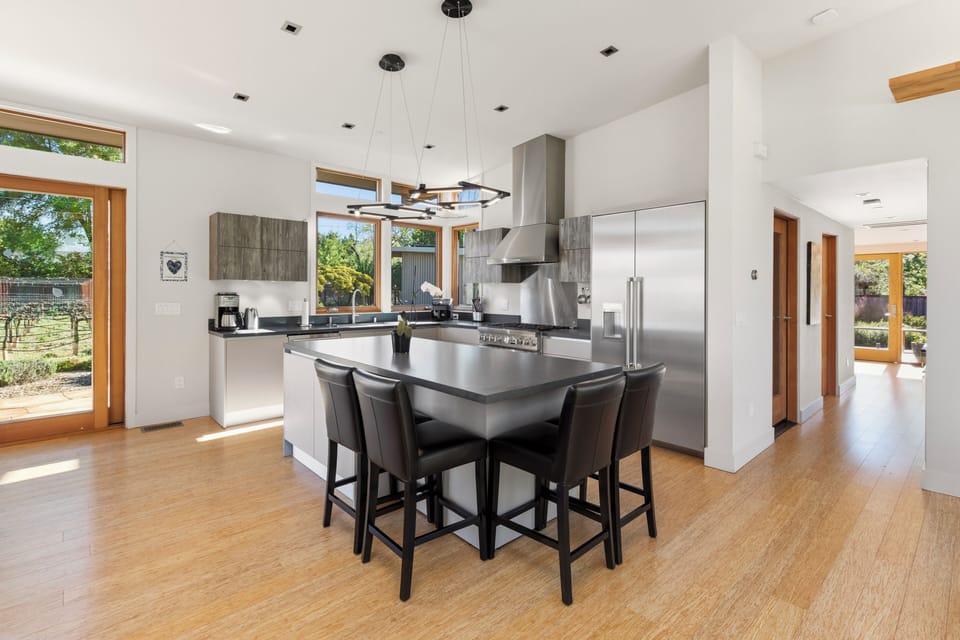 Your gourmet kitchen awaits with premium appliances and a spacious island perfect for morning coffee or culinary adventures.