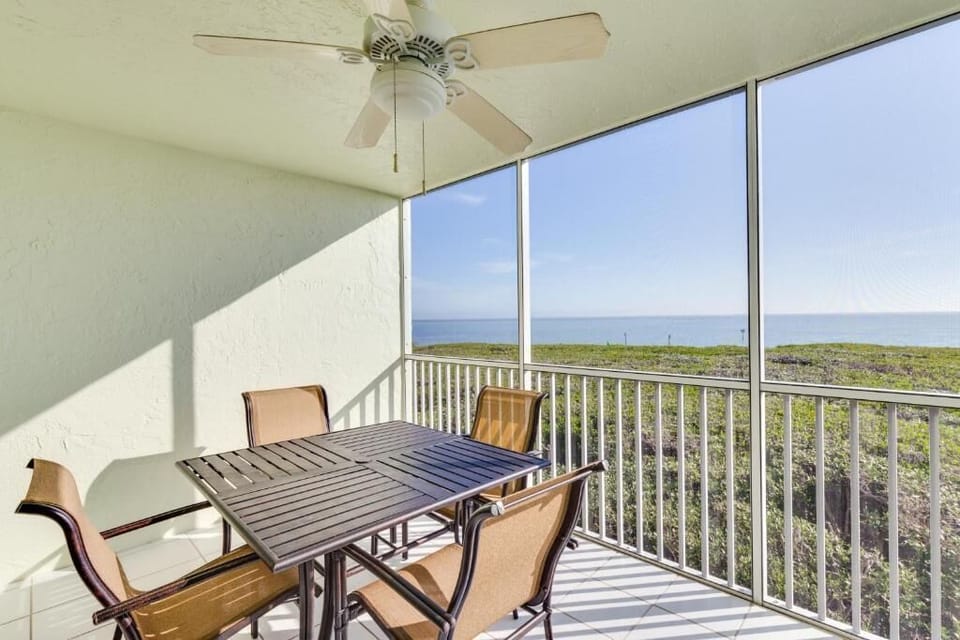 Sip morning coffee on the screened balcony overlooking the sea.