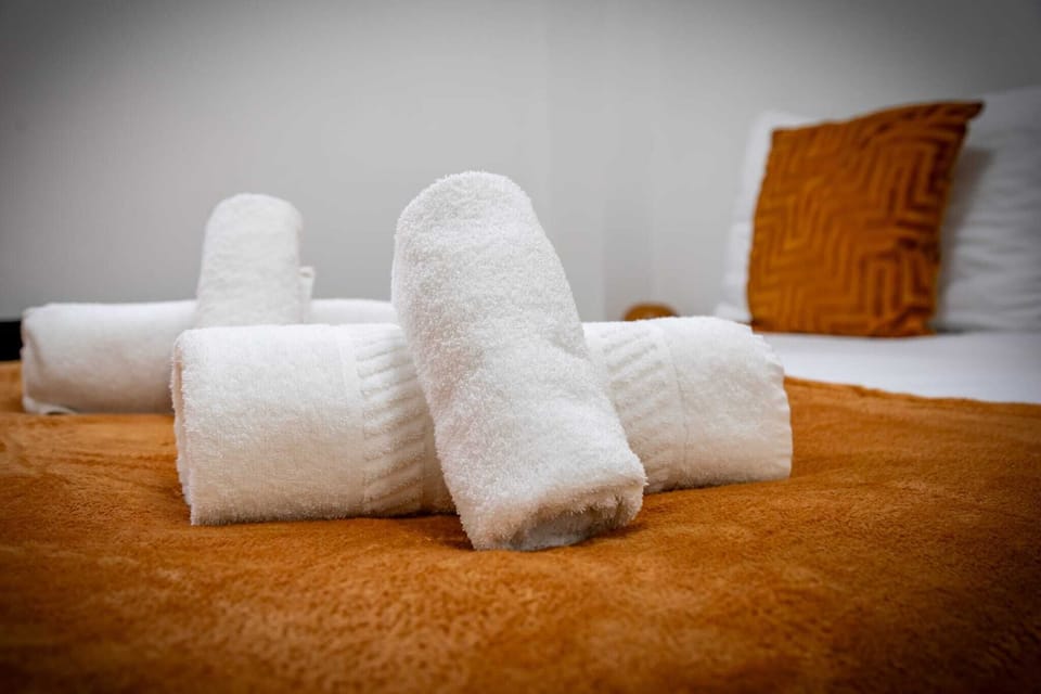 Charming Bedroom: Bright hues and plush decor invite relaxation after your adventures!