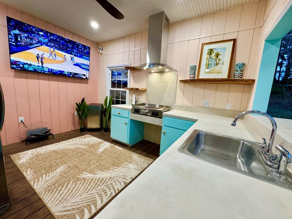 Full kitchen on the water with 75 inch TV, ice machine, and full sizerefrigerator/freezer. 