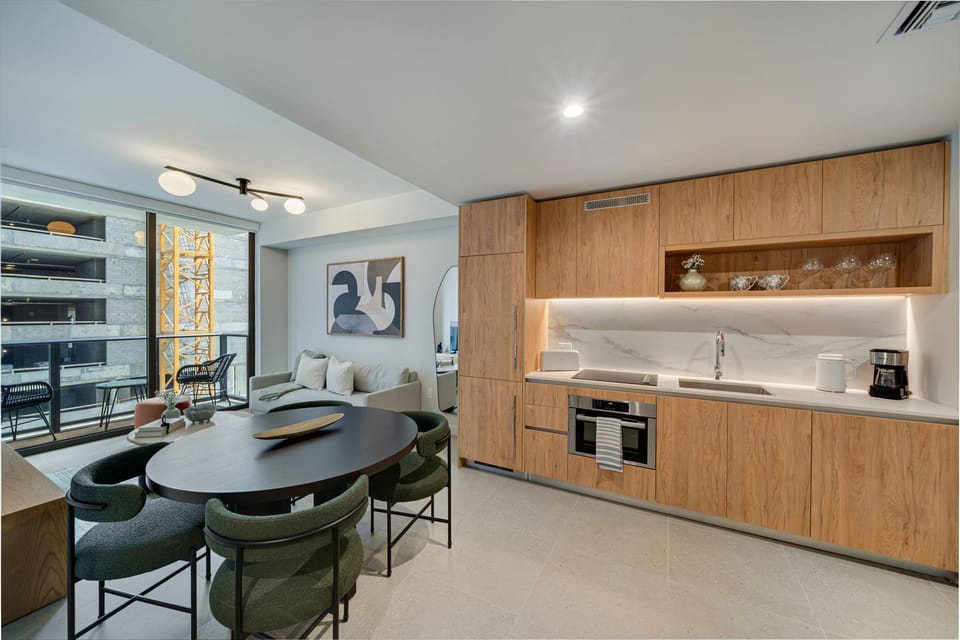 Modern open-concept kitchen with sleek cabinetry and a spacious dining area.