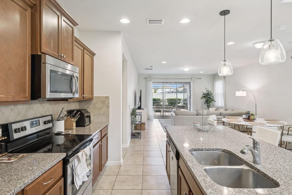 Spacious kitchen with modern appliances and breakfast bar
