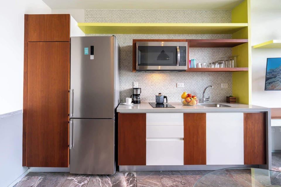 Fully equipped kitchenette with a full fridge and microwave, everything you need to cook in and stay a while