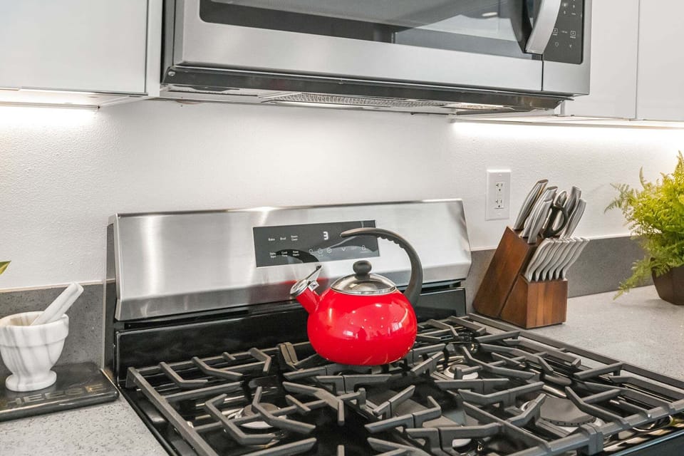 Modern kitchen with gas range and stainless appliances