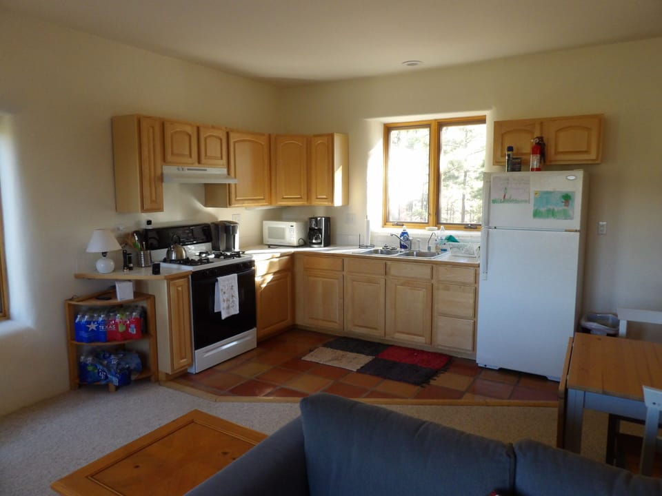 Gas range, Keurig and drip coffee makers, microwave, full size fridge