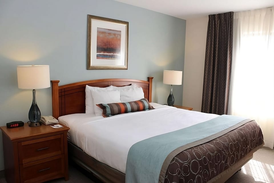 Relax beside the window in a calm, thoughtfully styled room.
