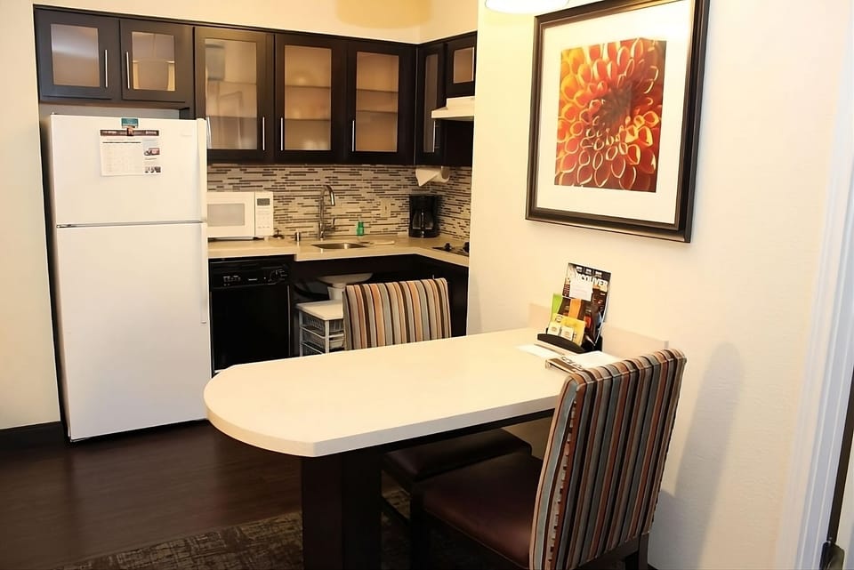 Gather for easy meals in a bright, modern kitchenette.