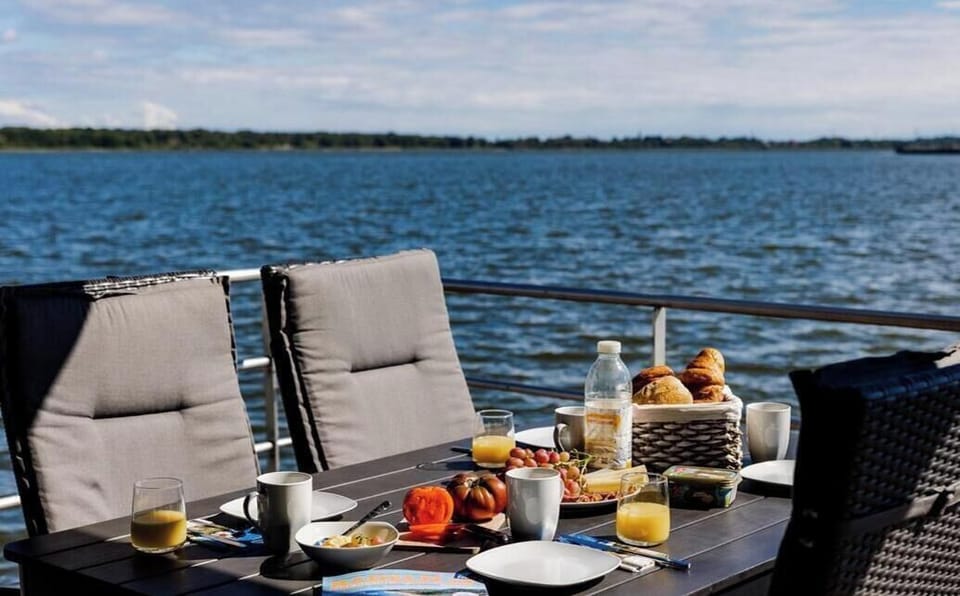 Terrace with Breakfast Table and Water View