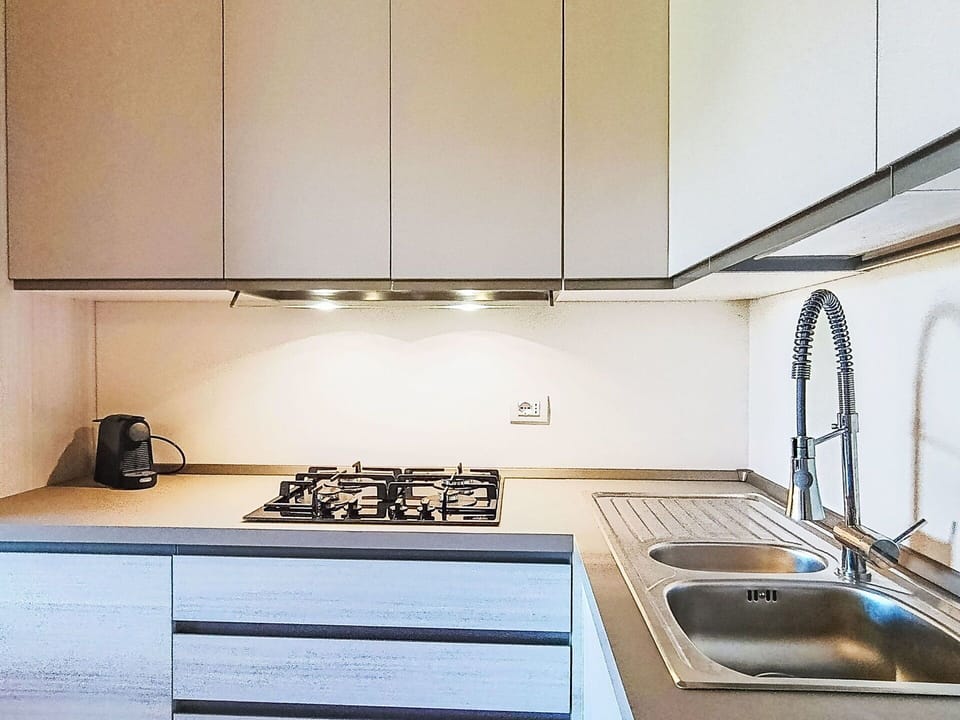 Kitchen, Kitchen Appliance, Countertop, Kitchen Stove, Major Appliance, Interior Design, Wood, Gas Stove, Stove, Cabinetry