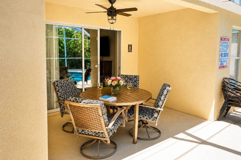 Covered and shaded patio with lush seating