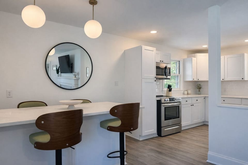 Counter for four, steps to full kitchen. Bright, open, easy gathering.
