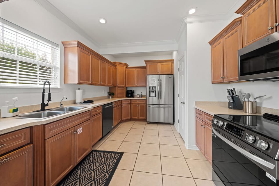 Cheerful kitchen with sleek stainless appliances, and ample counter space
