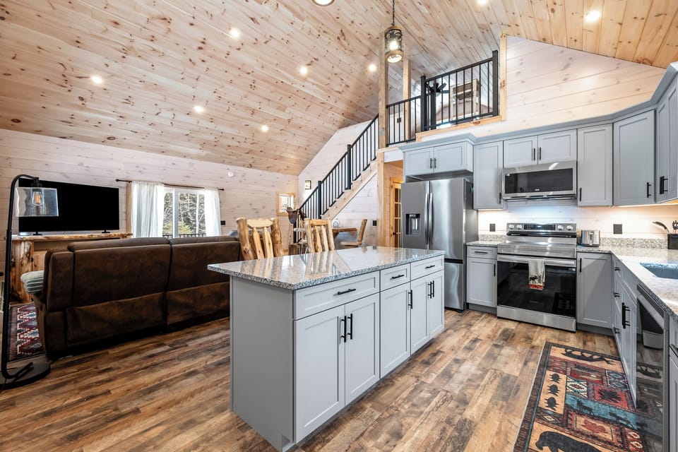 Kitchen, living room, and steps to loft